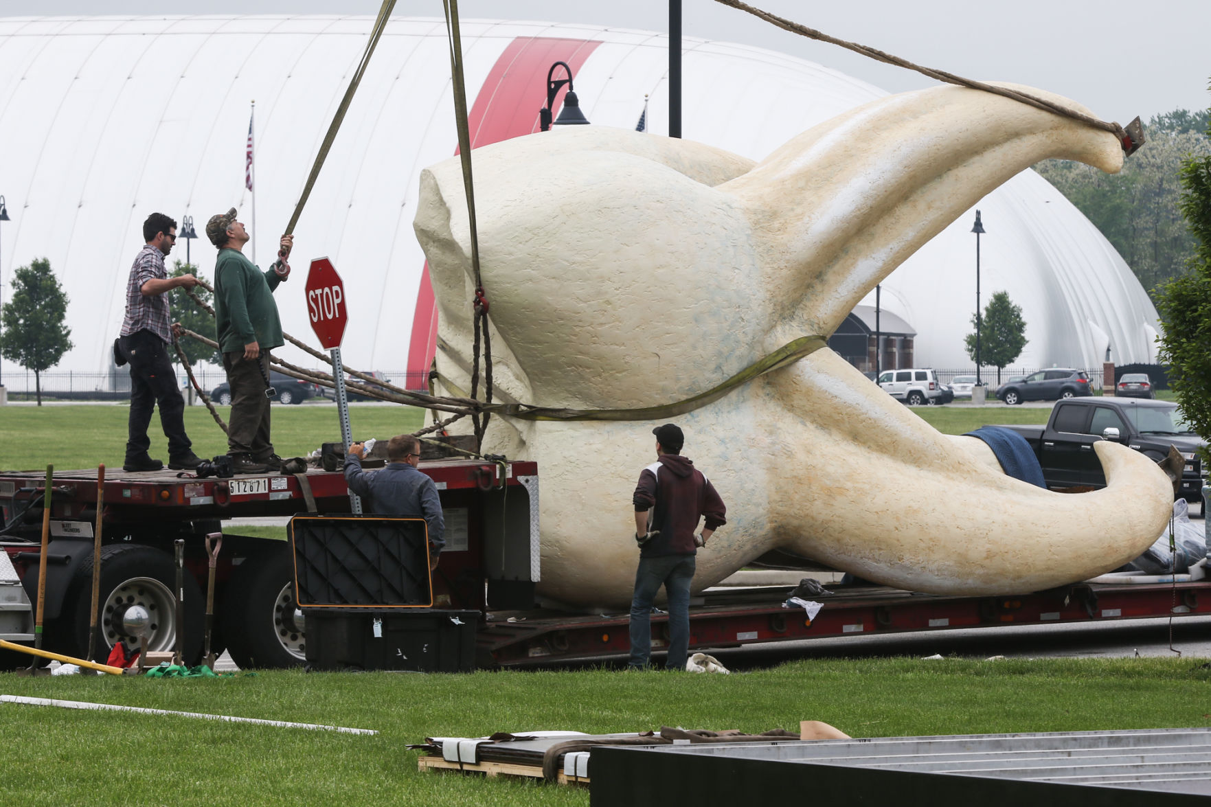 Artist Seward Johnson's "The Tooth" is implanted at the Crown Point Sportsplex